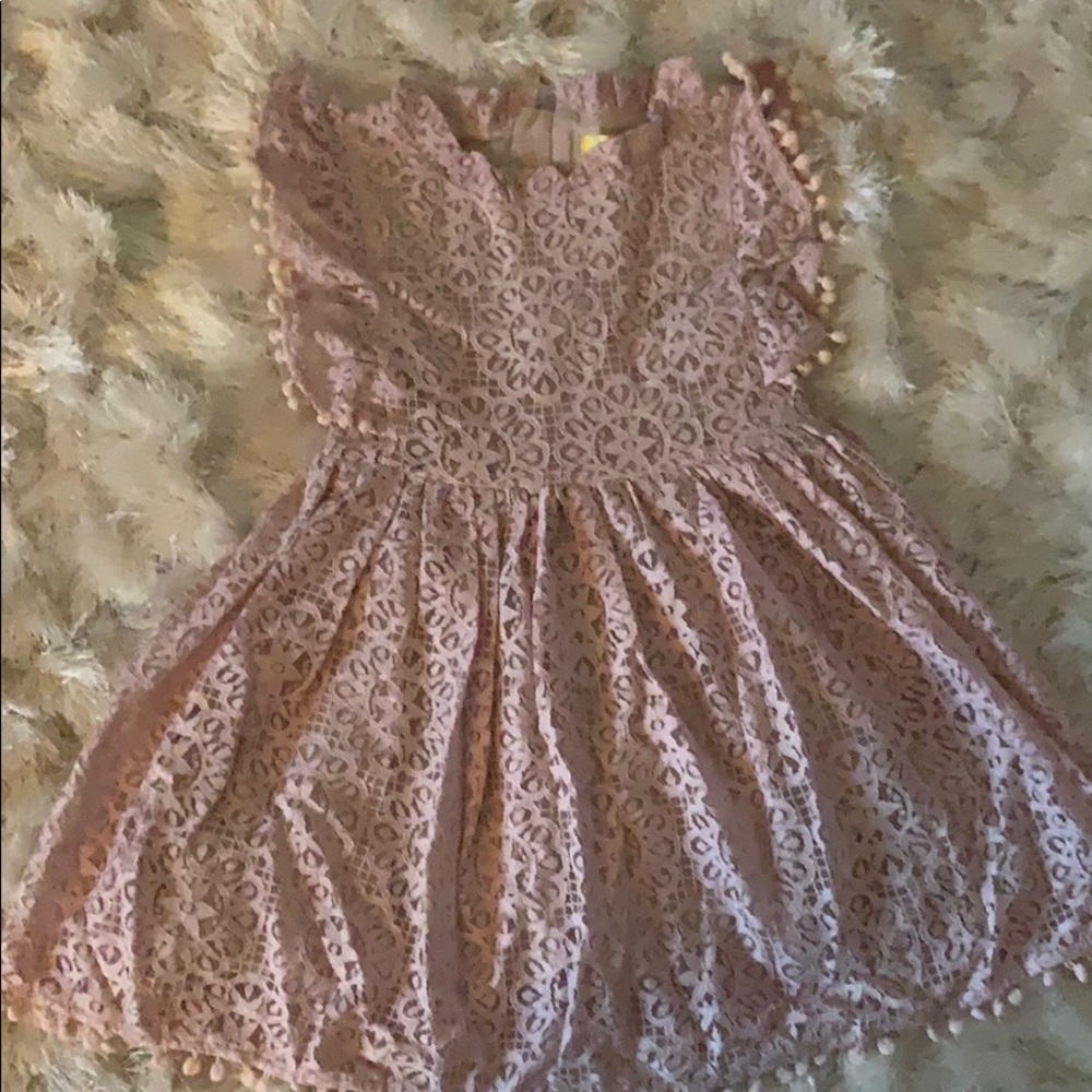 New. Never worn. Lace dress with Pom Pom detail.
